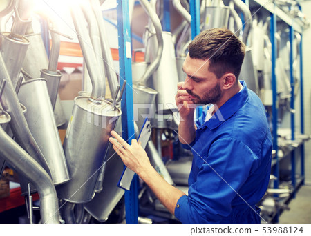 auto mechanic calling on phone at car shop 53988124