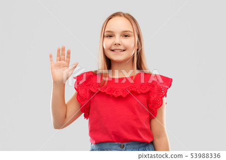 beautiful smiling girl in red shirt waving hand beautiful smiling girl in red shirt waving hand 53988336