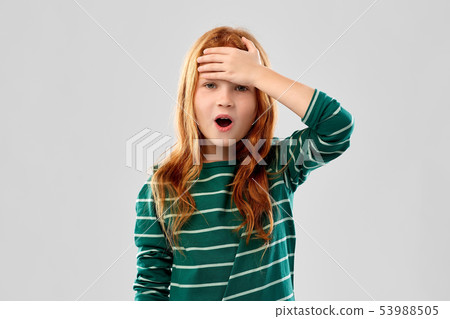 shocked red haired girl holding to her head shocked red haired girl holding to her head 53988505