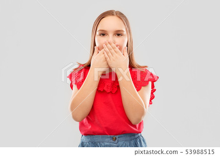 confused girl covering her mouth by hands 53988515