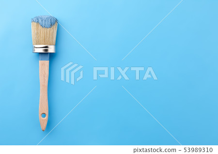 Brush tool in paint on blue background 53989310