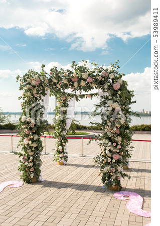 A festive chuppah decorated with fresh beautiful A festive chuppah decorated with fresh beautiful 53989411