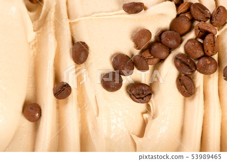 Vanilla creamy ice cream flavored with roasted coffee beans, to be served as a frozen tasty dessert. 53989465