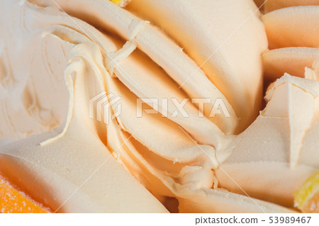 Vanilla creamy ice cream, to be served as a frozen tasty dessert, close-up. 53989467