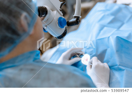 A professional ophthalmologist performs eye 53989547