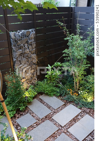 A small garden with a gabion Light up when twilight 53990241