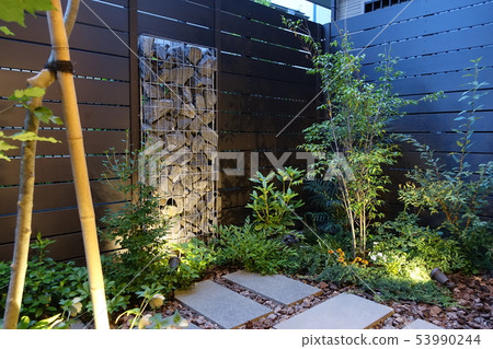 A small garden with a gabion Light up when twilight A small garden with a gabion Light up when twilight 53990244