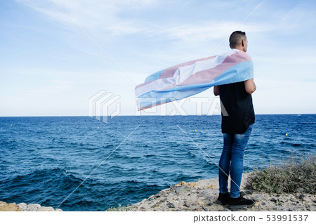young person with a transgender pride flag 53991537