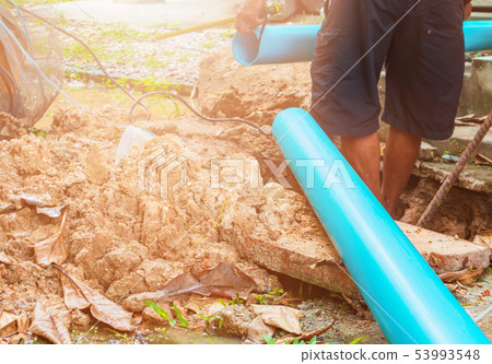 broken pipe in hole with water motion at roadside broken pipe in hole with water motion at roadside 53993548
