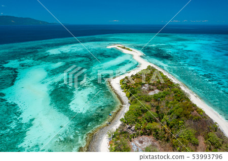 Aerial view of a tropical island in the middle of the ocean. Aerial view of a tropical island in the middle of the ocean. 53993796