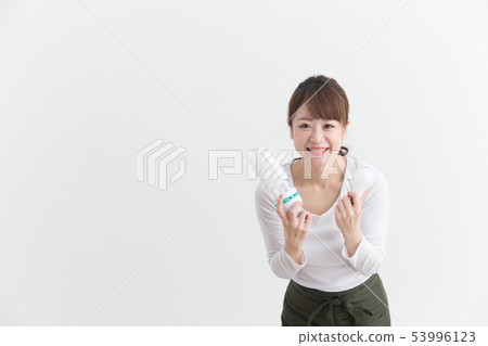 Woman in white apron · White back 53996123