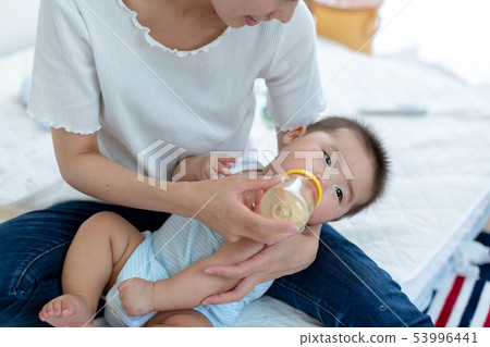 Breastfeeding Mom and 6 month baby 53996441