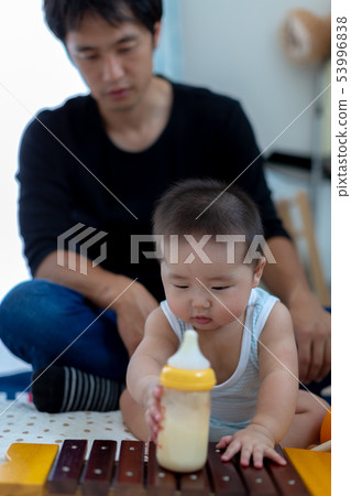 Breastfeeding Daddy and 6 month baby Breastfeeding Daddy and 6 month baby 53996838
