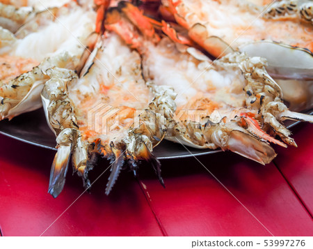 Grilled big tiger shrimps prawns on Plate. Grilled big tiger shrimps prawns on Plate. 53997276