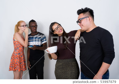 Studio shot of happy diverse group of multi ethnic friends smili Studio shot of happy diverse group of multi ethnic friends smili 53997879