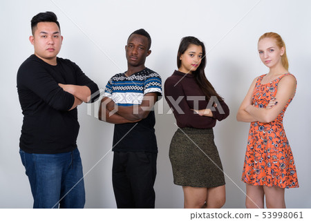 Studio shot of diverse group of multi ethnic friends with arms c Studio shot of diverse group of multi ethnic friends with arms c 53998061