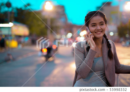 Young beautiful Asian tourist woman exploring Nakhon Pathom prov 53998332