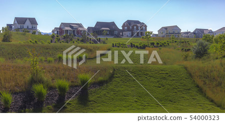 Homes with sloping grassy terrain in Daybreak Utah 54000323