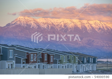 Homes against Mount Timpanogos lit by setting sun Homes against Mount Timpanogos lit by setting sun 54000590