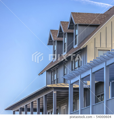 Home against blue sky with contrail on a sunny day 54000604