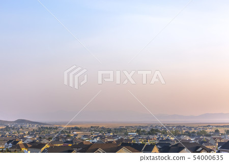 Hazy sky over homes in Eagle Mountain Utah 54000635