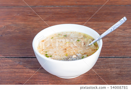 Boiled pork in white bowl on wooden table. Boiled pork in white bowl on wooden table. 54008781