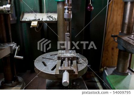 Drilling with a drilling machine Drilling with a drilling machine 54009795