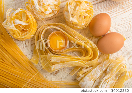 Raw yellow italian pasta pappardelle, fettuccine 54012280