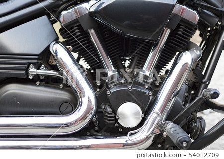 Cropped image of new motorcycle in shop. Motorcycles and accessories in modern motorcycle custom 54012709