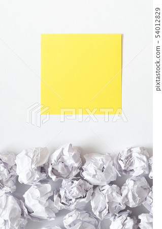 inspiration white crumpled paper ball yellow note 54012829