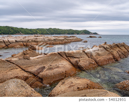 The stunning rock formations of Tatsukushi Coast: A magnificent geological landscape of Tosa nestled within a marine park. 54012931