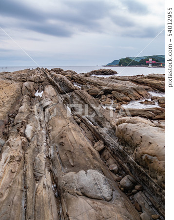 The coastline of Tatsukushi: A spectacular view of unique geological formations and rocky cliffs bordering a blue bay. The coastline of Tatsukushi: A spectacular view of unique geological formations and rocky cliffs bordering a blue bay. 54012955