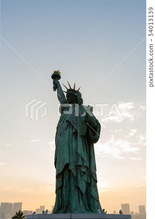 Statue of liberty at sunset Statue of liberty at sunset 54013139