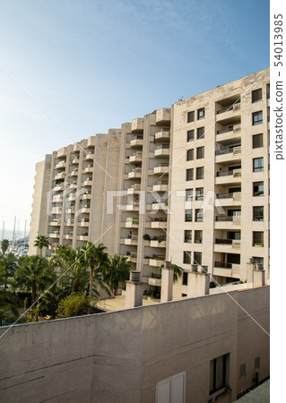 Skyline of Mallorca Spain under the blue sky in the morning A thin pastel apartment standing beside the yacht harbor Skyline of Mallorca Spain under the blue sky in the morning A thin pastel apartment standing beside the yacht harbor 54013985