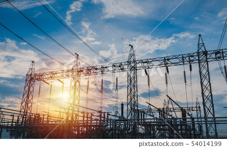 Sunset behind substation towers with blue sky Sunset behind substation towers with blue sky 54014199