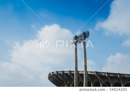 Sports Light with back stadium blue sky background Sports Light with back stadium blue sky background 54014203