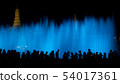 Silhouette of people with blue of fountain curtain 54017361