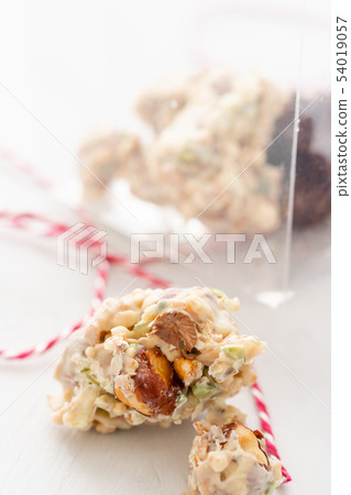 Rocks with chocolate and nuts. Christmas theme. Healthy sweet dessert snack. Granola bar with nuts Rocks with chocolate and nuts. Christmas theme. Healthy sweet dessert snack. Granola bar with nuts 54019057