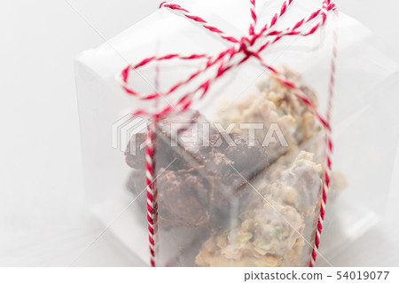Rocks with chocolate and nuts. Christmas theme. Healthy sweet dessert snack. Granola bar with nuts 54019077