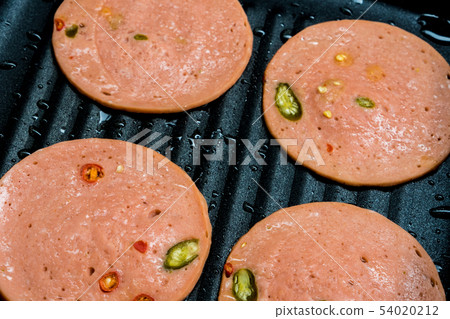 Spices Bologna fried in pan Spices Bologna fried in pan 54020212