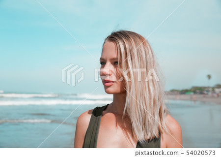 Portrait of beautiful woman in summer on tropical beach closed to ocean. Portrait of beautiful woman in summer on tropical beach closed to ocean. 54020573