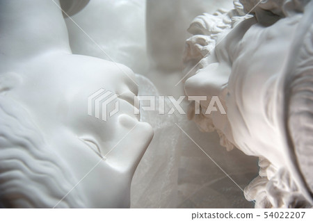 Antique statues of woman and man heads close up. Concept of style, vintage, love. Antique statues of woman and man heads close up. Concept of style, vintage, love. 54022207