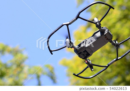 Drone with photocamera take off from land and Drone with photocamera take off from land and 54022613