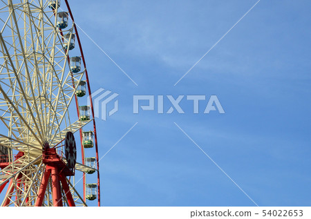 Entertainment Ferris wheel against the clear blue Entertainment Ferris wheel against the clear blue 54022653