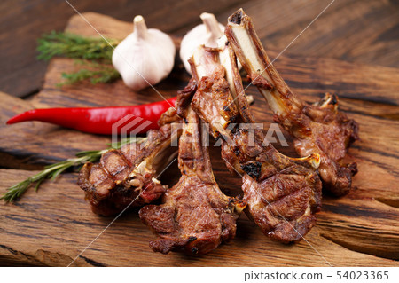 spicy grilled lamb ribs loin on serving board spicy grilled lamb ribs loin on serving board 54023365
