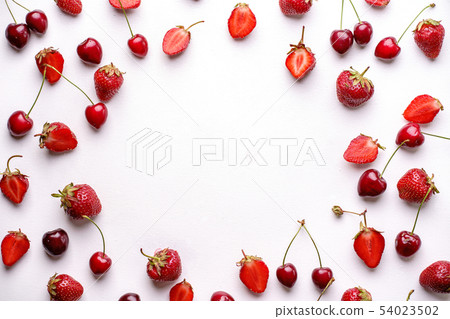 Cherries and strawberries on white background Cherries and strawberries on white background 54023502