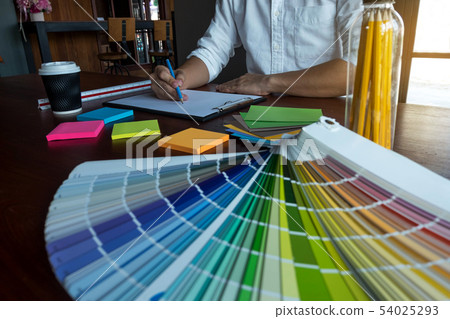 Graphic designer choose color bands samples. 54025293