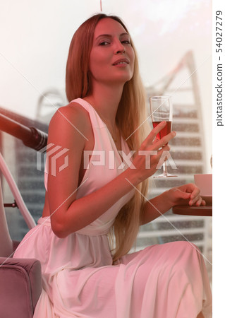 Young beautiful woman with long blond hair on 54027279