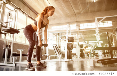 young fitness sport girl doing exercise squat with young fitness sport girl doing exercise squat with 54027717