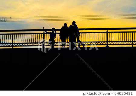 Silhouettes a Group of People on the High Bridge 54030431
